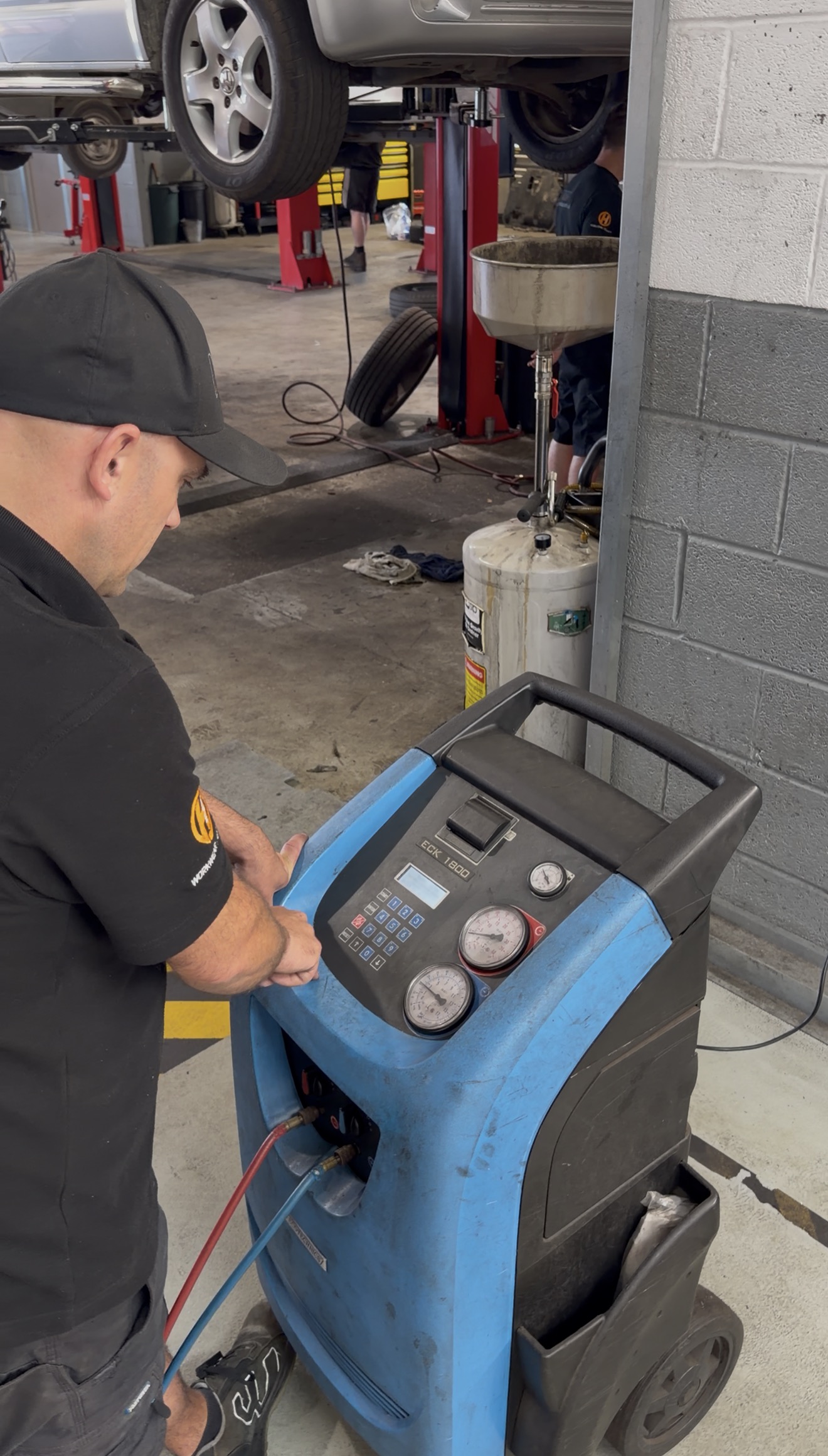 Air conditioning regas machine connected to vehicle at NMD Automotive