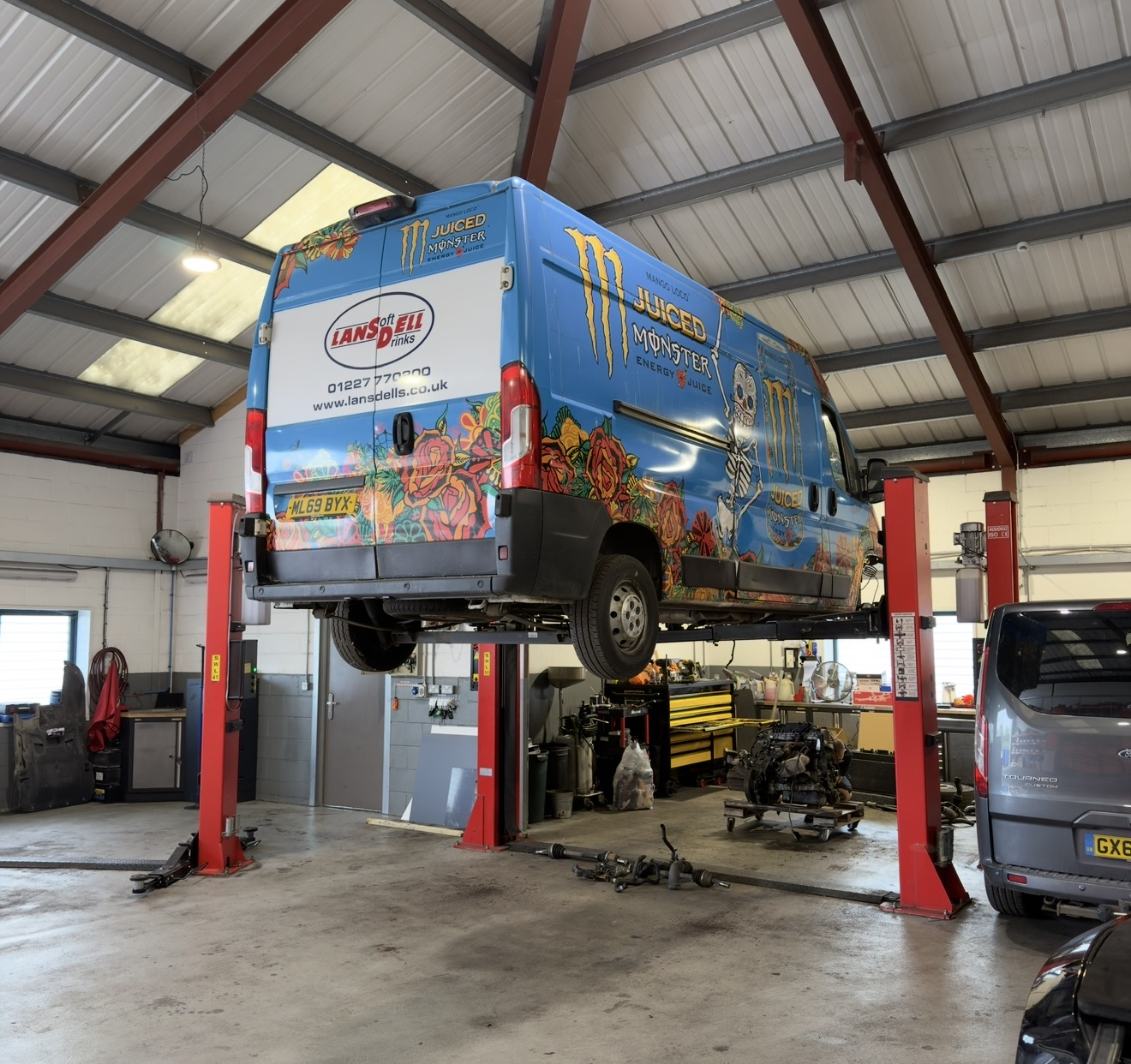 Fleet vans being serviced at NMD Automotive workshop